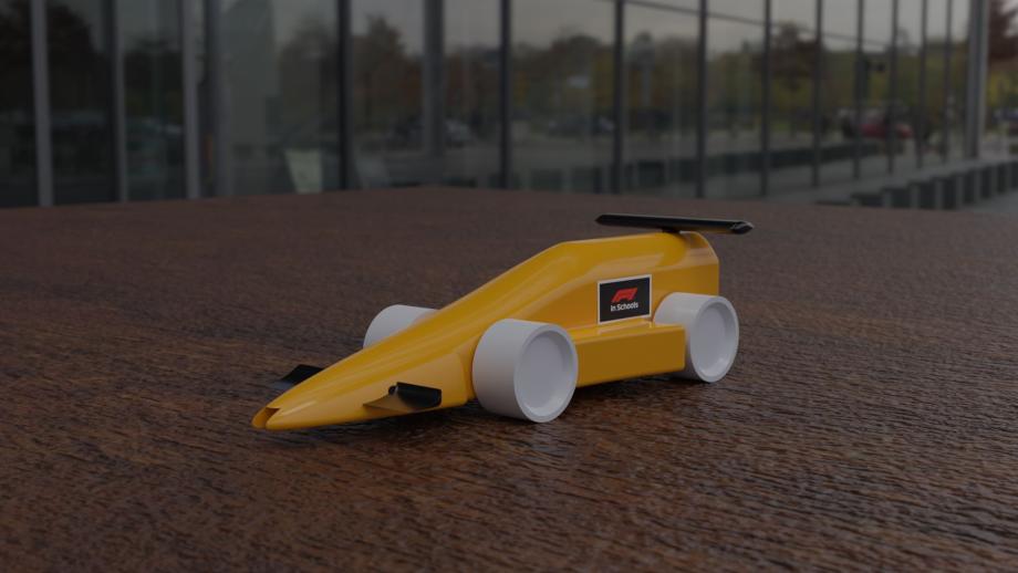 small yellow model race car with a sticker that says F1 in schools