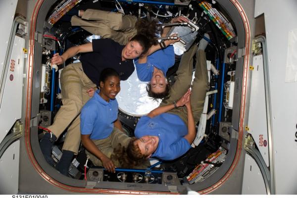 Four women astronauts in cupola of the International Space Station