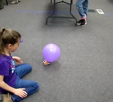 Girl tests balloon car