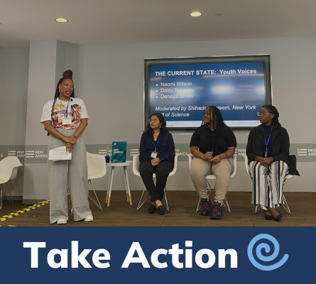 Take Action - Photo of 4 people on a small stage in front of a screen