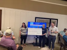 Karen Peterson receiving gift from citizens bank