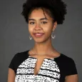 Jamora Arroyo Jefferson - young woman with curly black hair wearing black and white top