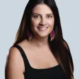 Photo of Katelyn Wamsted - woman with long, brown hair wearing black tank top