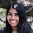 Photo of Roohi Dalal - woman with long black hair standing in front of a tree