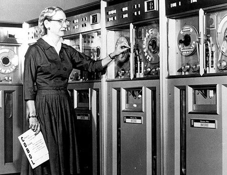 Grace Hopper in front of a compiler