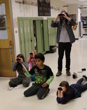 Club members using binoculars